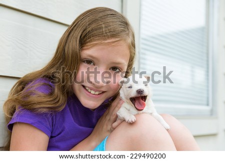 Girl playing with puppy chihuahua pet dog outdoor