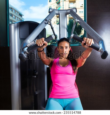 http://image.shutterstock.com/display_pic_with_logo/304216/235514788/stock-photo-brunette-woman-seated-chest-press-machine-workout-exercise-at-gym-235514788.jpg