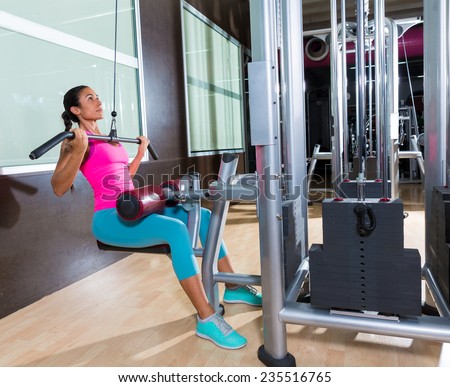 Cable Lat pulldown machine woman workout at gym exercise