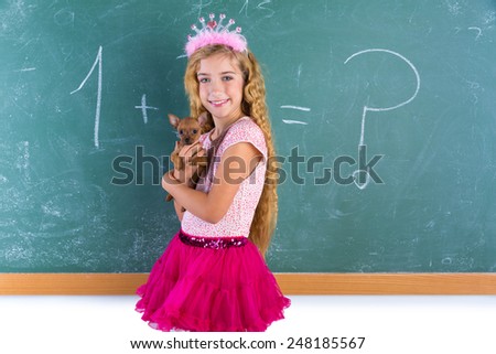 Blond princess schoolgirl holding pet chihuahua puppy dog in classroom green chalk board