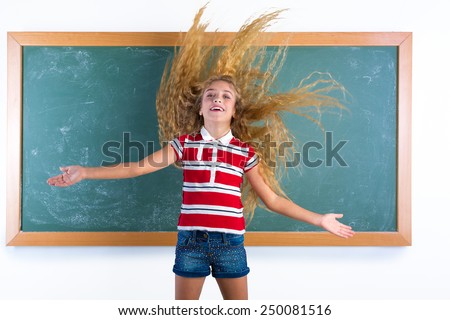 funny student girl flipping long blond hair at school classroom chalk board