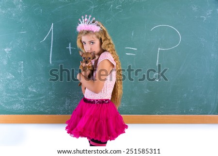 Blond princess schoolgirl holding pet chihuahua puppy dog in classroom green chalk board