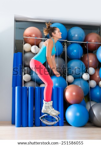 Kangaroo jumps anti gravity fitness boots girl at gym indoor