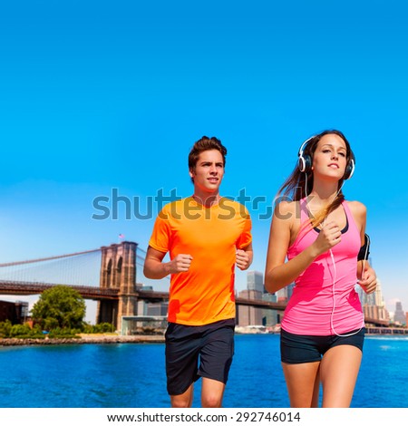 Couple running in New York Brooklyn photo mount in pink and orange colors