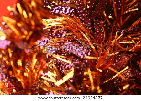 Abstract composition of christmas golden decoration over red background
