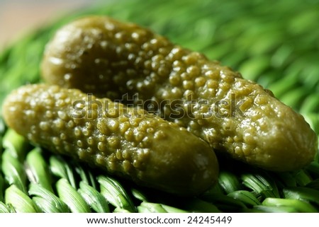 Green pickles macro detail studio shot, textured skin