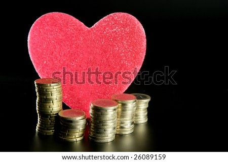 Love and money metaphor. Valentines candy heart and euro coins