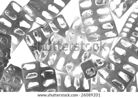 Pills tabs blister silver texture over white background