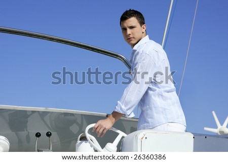 Handsome young man on boat, blue summer vacation outdoor