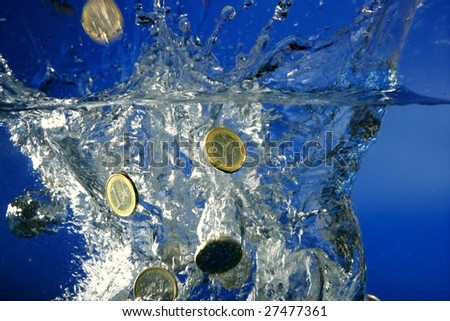 Euro coins falling down to water, metaphor of bankruptcy, crisis, crack.