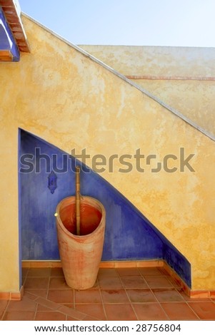 Spanish golden wall under stairs grunge blue, nice courtyard