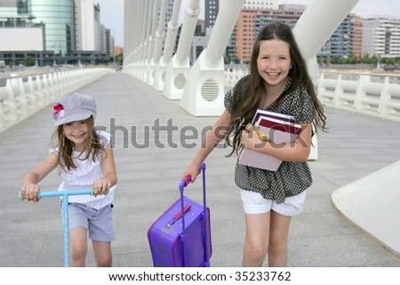 Little girls going to school with bags, books and student stuff