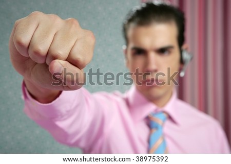 angry aggressive businessman with fist closeup to camera