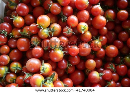 Abstract texture pattern of red cherry tomatoes in marketplace
