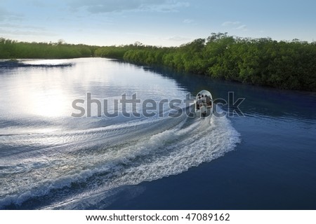Boat ship wake prop wash curve on sunset lake river