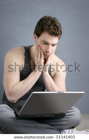 student gesture with laptop over gray background