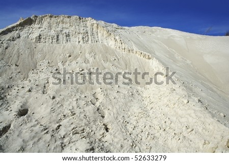 white sand mound quarry like a moon landscape