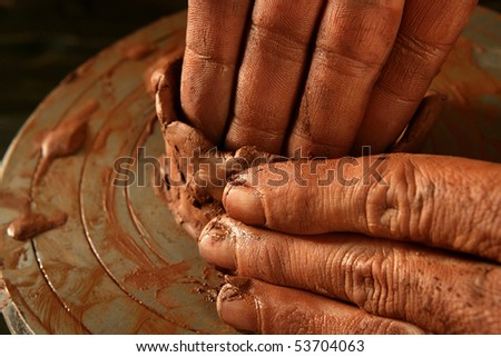 pottery craftsmanship red clay potter hands work finger closeup