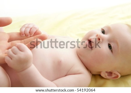 stock photo nude blond baby playing mother hands together