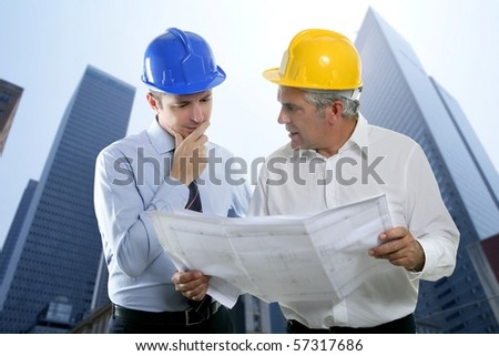 architect engineer two expertise team plan talking hardhat skyscraper buildings [Photo Illustration]