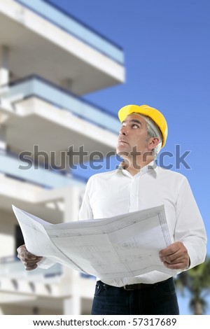 expertise architect senior engineer plan looking up city construction buildings [Photo Illustration]