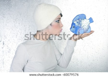woman profile holding fish kissing expression silver background