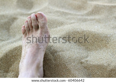 man foot in summer beach sand vacation holidays metaphor