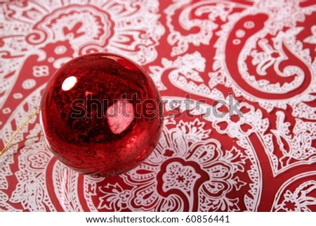 Christmas red ball over indian pattern background