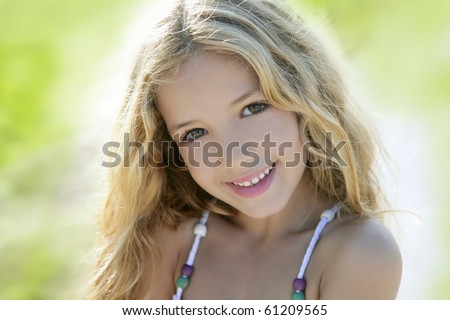 Happy smiling beautiful girl portrait green outdoor closeup