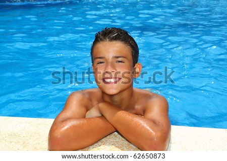 boy happy teenager vacation swimming pool blue water portrait