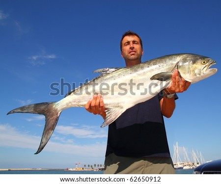 Fisherman holding catch Garrick Lichia Amia Leerfish Leervis fishJack