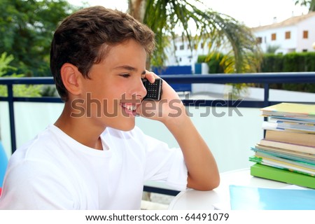 stock photo Boy teen talking mobile phone happy smiling student outdoor