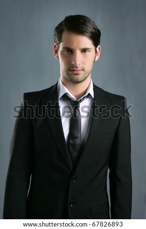 Fashion trendy elegant young black suit man posing looking camera