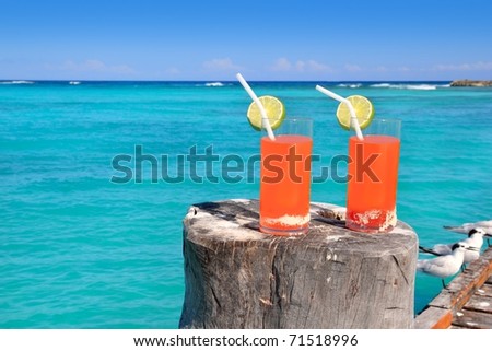 beach orange cocktail in Caribbean turquoise beach [Photo Illustration]