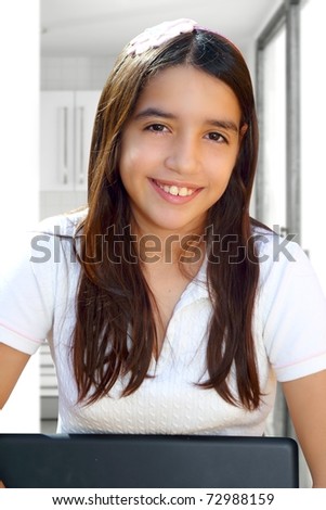 Latin teenager student smiling holding laptop indoor white house [Photo Illustration]
