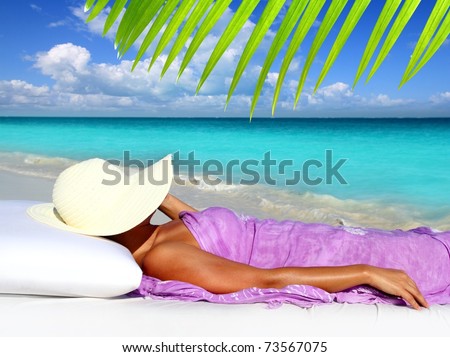 Caribbean tourist resting beach hat woman hammock bed [Photo Illustration]