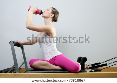 stock photo aerobic gym pilates woman rest drinking water bottle in