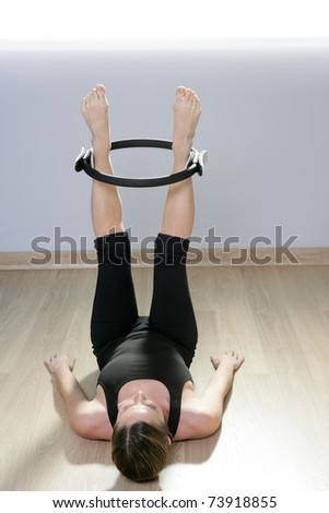 magic pilates ring woman aerobics sport gym exercises on wooden floor