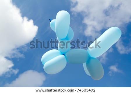 stock photo balloon with poodle dog caniche shape flying in blue sky sunny