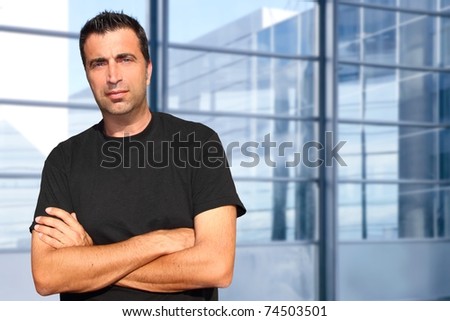 Mid age man portrait in urban modern office buildings [Photo Illustration]