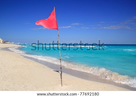 dangerous red flag in beach with rough sea signal