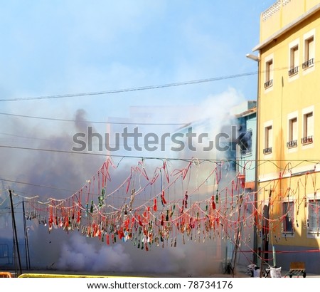 fireworks firecrackers exploding in smoke street in Spain fest