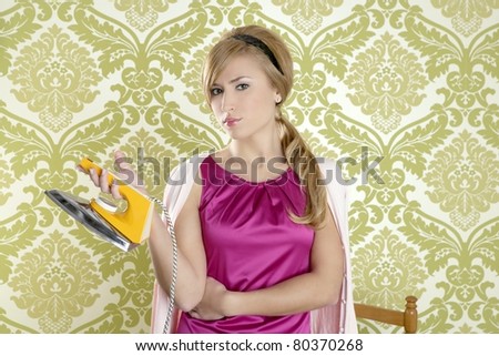 vintage woman with retro clothes iron like an humor housewife over  wallpaper