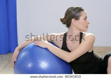 aerobics fitness woman relaxed with pilates stability blue ball