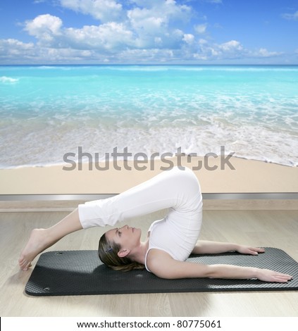 beautiful woman in black mat yoga in front a window view of tropical beach [Photo Illustration]