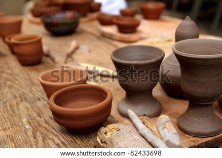 clay pottery ceramics on vintage table at artisan studio