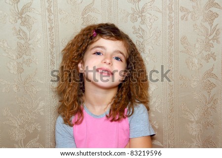 little girl happy with funny expression on vintage retro wallpaper