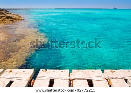 Illetes illetas beach with wooden pier and turquoise sea Formentera Balearic Mediterranean island