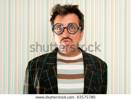 nerd silly myopic man with glasses doing funny expression with retro mustache