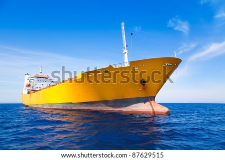 Anchor cargo yellow boat in blue sea under summer sky